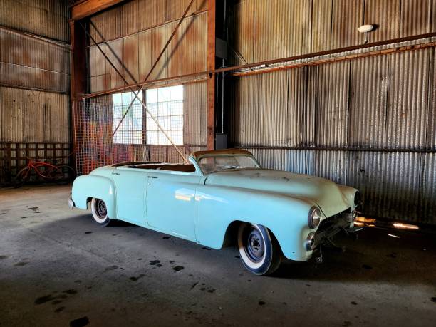 Abandoned vintage car in old warehouse