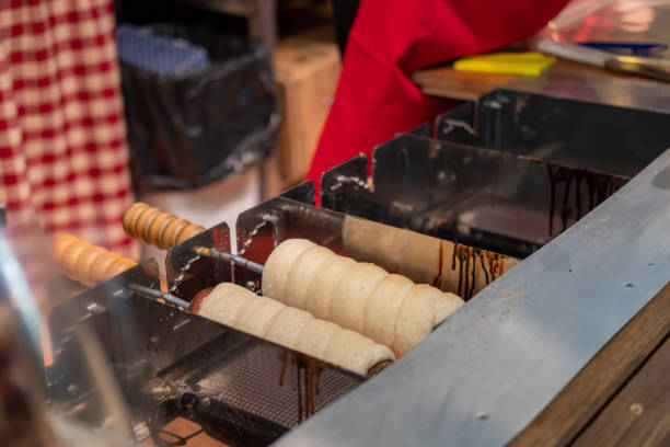 istock Process of baking chimney cake in a Christmas market 1928924759
