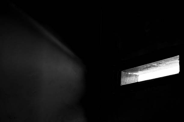 istock light entering the dark room from the ventilation hole 1928954290