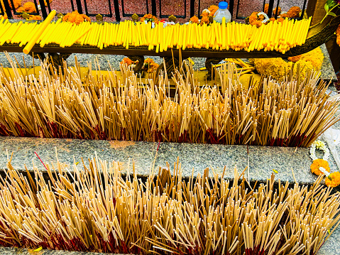 Incense in a pot at the shrine in Thailand.