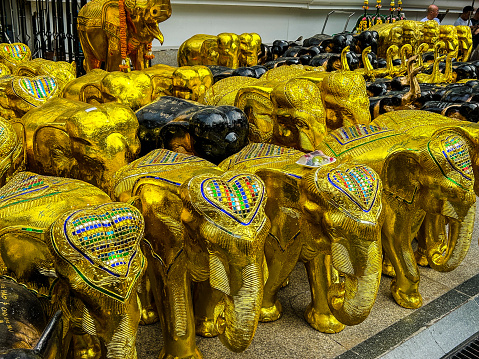 The beautiful elephant statues at shrines for offerings.