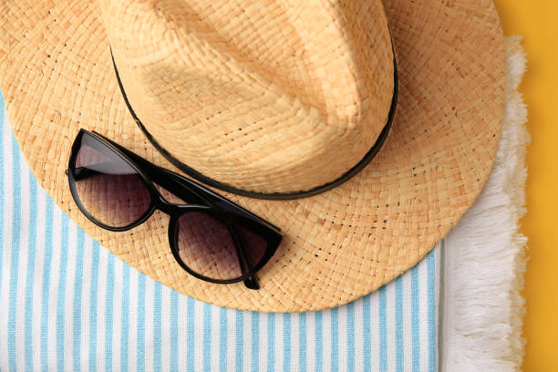 istock Flat lay composition with beach accessories on yellow background 1928961533