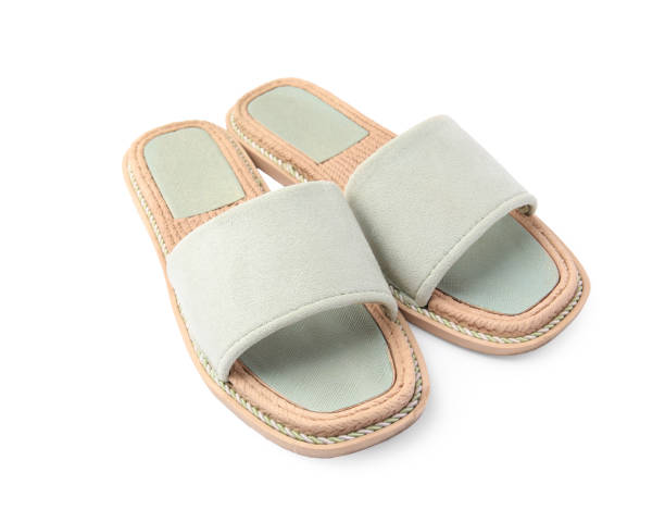 istock Stylish light grey slippers isolated on white 1928964623