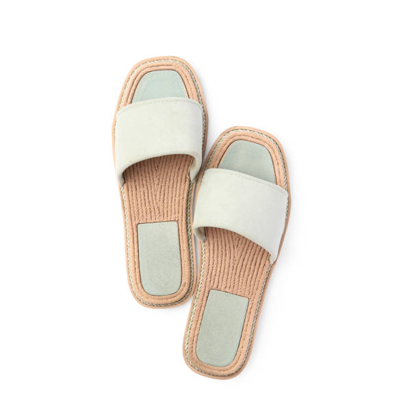istock Stylish light grey slippers isolated on white, top view 1928965129