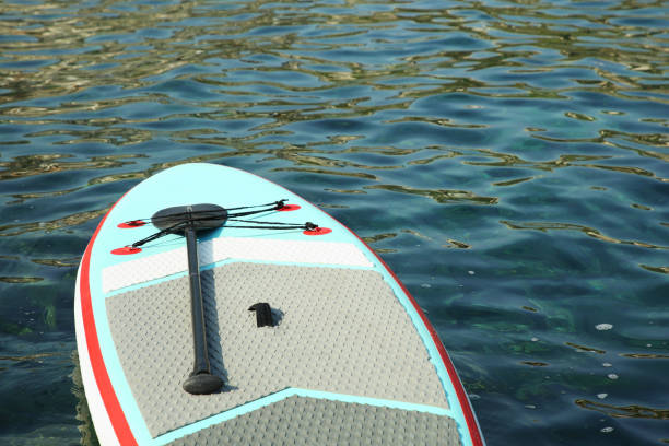 istock One SUP board with paddle on sea water 1928980528