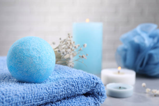 istock Beautiful aromatic bath bomb on towel, closeup. Space for text 1928991287