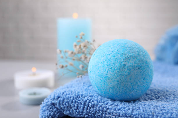 istock Beautiful aromatic bath bomb on towel, closeup. Space for text 1928991291