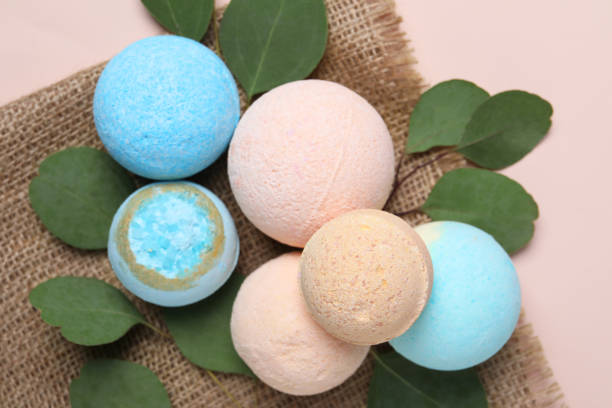 istock Bath bombs, eucalyptus leaves and burlap fabric on beige background, flat lay 1928993348