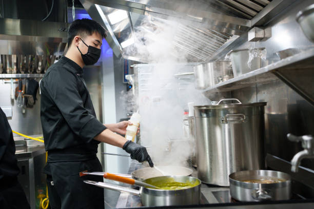 istock chef cooking food 1928996944