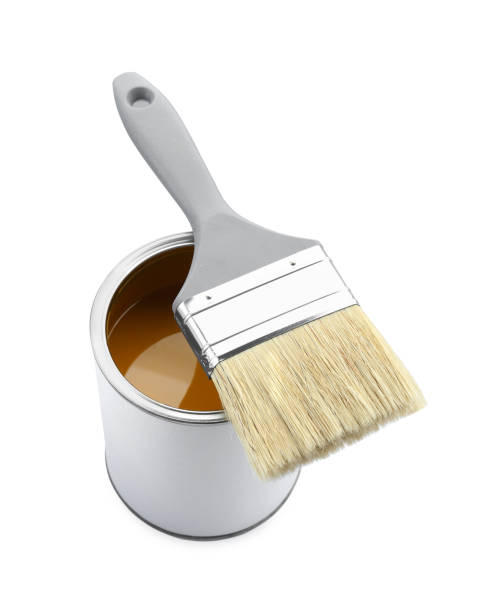 istock Can of yellow paint with brush isolated on white 1929001665