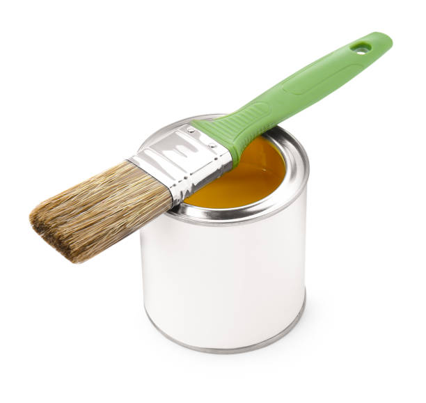 istock Can of yellow paint with brush isolated on white 1929002204