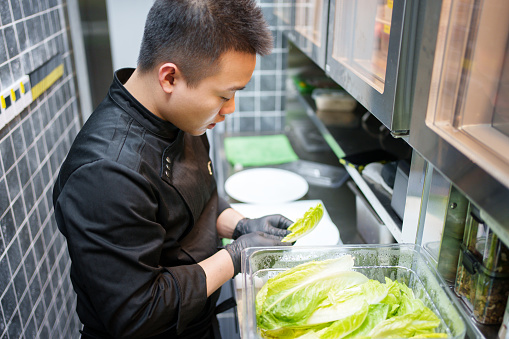 Chef preparing vegetable salad