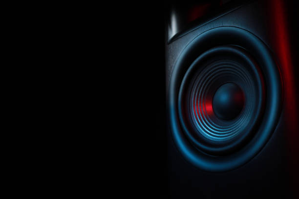 istock One sound speaker in neon light on black background, closeup. Space for text 1929009629