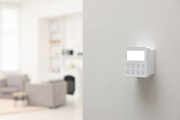 istock One thermostat on white wall indoors, space for text. Smart home system 1929013757