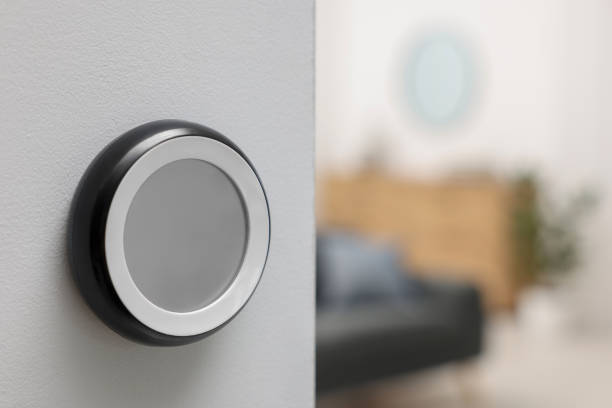 istock One thermostat on white wall indoors, space for text. Smart home system 1929013763