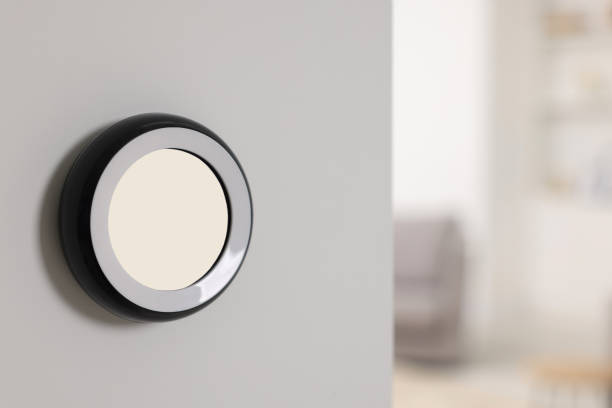 istock One thermostat on white wall indoors, space for text. Smart home system 1929013771