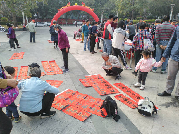 Jiangmen,Guangdong,China-January 13,2024:Every year, in China, the Spring Festival is approaching, people writing Spring Festival couplets in order to preparing for the lunar Spring Festival.