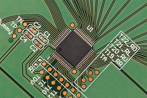 A microprocessor board, close-up, with a craquelure effect applied. Macro photography