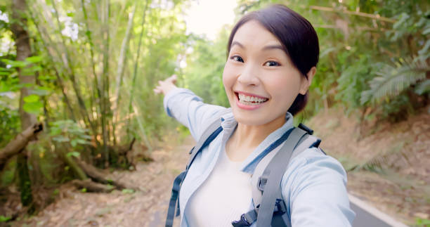 Asian woman hiking in mountain