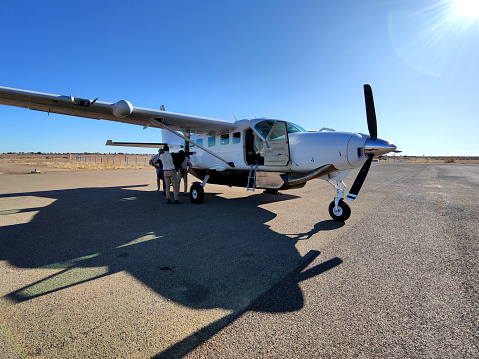 Arusha, Tanzania - december 28, 2019 : Small propeller airplane before takeoff at Arusha airport, Tanzania, east Africa