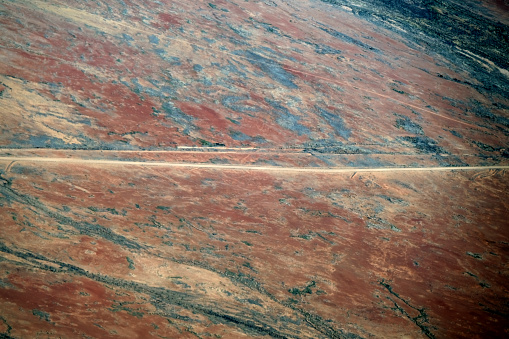 Aerial view of the Oodnadatta track, an unsealed 614 km outback road in South Australia, connecting Marla to Marree.
