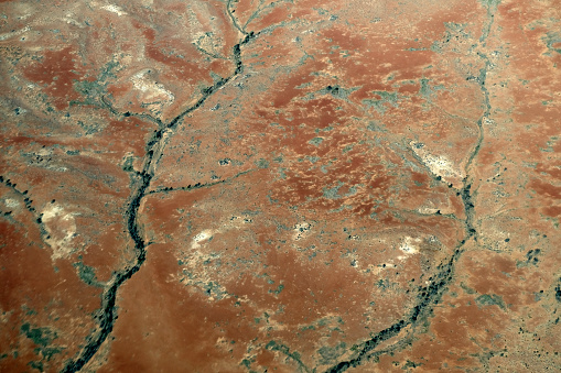 Aerial view of dry riverbeds in the desert near the town of Marree, South Australia state.