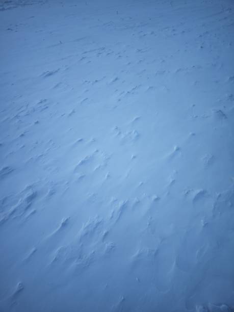 istock Abstract rough snow ground texture natural snowfield terrain blizzard pattern background 1929236746