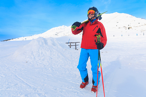 Skiing winter sport.  Vital senior men, Happy snow skier, enjoying on sunny ski resorts.  Snowcapped mountain  Dolomite super ski area. Ski resort. italy, Europe