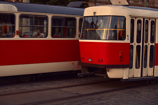 Streetcar stands at a stop light in downtown Toronto Ontario Canada in the evening.