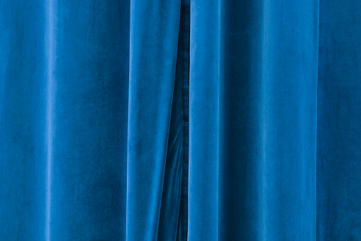 Closed blue stage curtain.