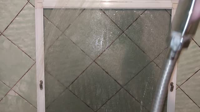 Washing mosquito nets for metal-plastic windows