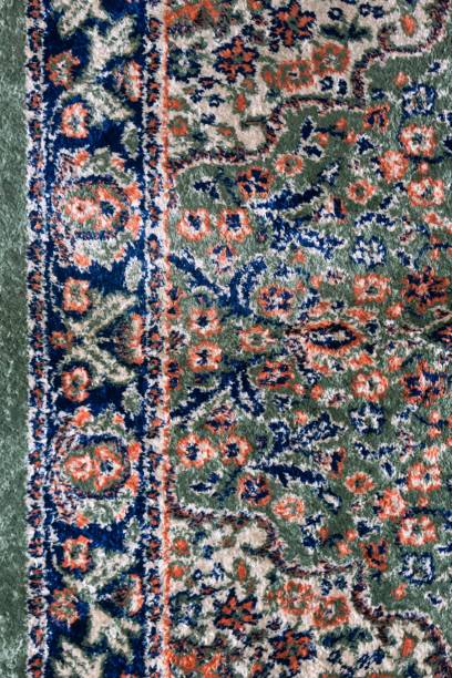 istock Close up textures background and patterns in color from woven carpets. Traditional wool Turkish rug. Handmade and decorative. 1929386045