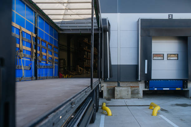 istock Close up of empty truck parked in warehouse loading dock. 1929409668