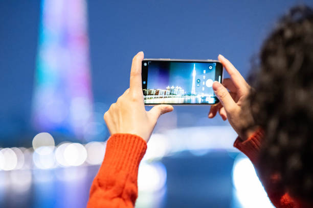 istock Tourists taking photos of night scenery 1929457149
