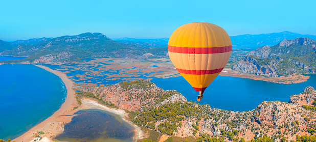 Hot air balloon flying over Iztuzu beach in Dalyan, Turkey