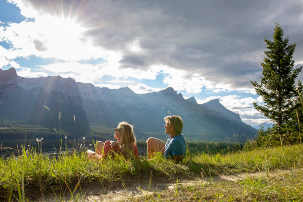 istock Mature couple relax on mountain ridge 1929512779