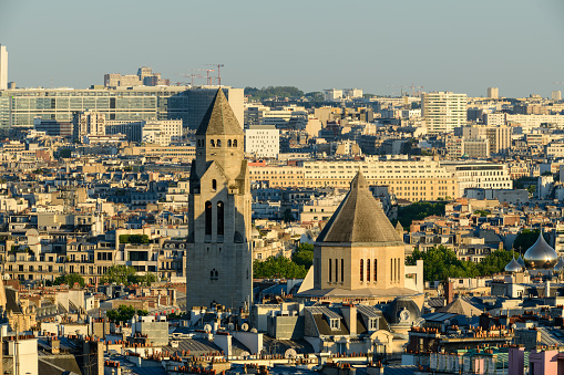 This landscape photo was taken, in Europe, in France, in ile de France, in Paris, in summer. We see the Church of Saint-Pierre-de-Chaillot, under the Sun.