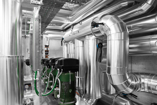 HVAC system pipes and pumps, handling heating, ventilation, air conditioning, and cooling, tubes are located on the ceiling. Climate control system ensures the comfort of the rooms in the building.