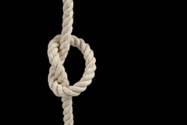 istock Rope with a knot on dark background 1929573657