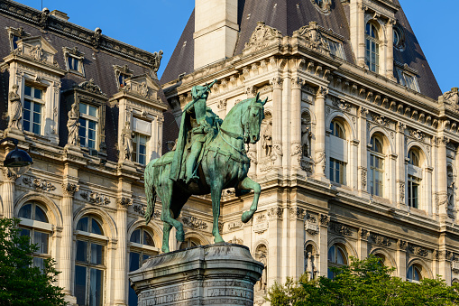 This landscape photo was taken, in Europe, in France, in ile de France, in Paris, in summer. We see the Statue of Etienne Marcel, under the Sun.