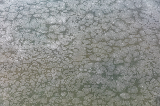Texture of water frozen into ice during winter, resembling crystals