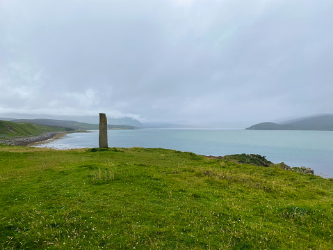 Standing stone with Celtic symbol by River Dionard in Kyle of Durness