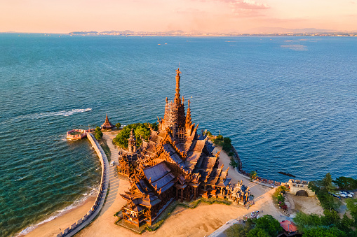The Sanctuary of Truth wooden temple in Pattaya Thailand at sunset