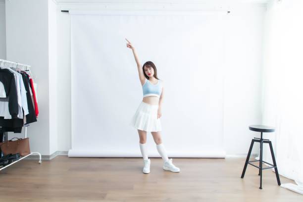 Cheerleading in front of a white background