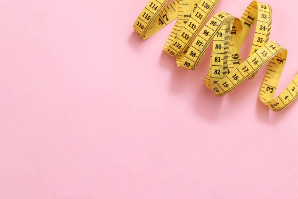 istock tape measure for obese people on a pink background soft focus 1929662315