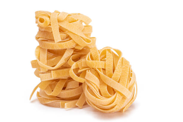 istock Three Classic Italian Raw Egg Fettuccine - Isolated on White Background 1929662343