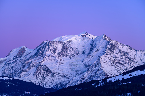 This landscape photo was taken in Europe, in France, Rhone Alpes, in Savoie, in the Alps, in winter. You can see the Mont Blanc massif and its night forests.