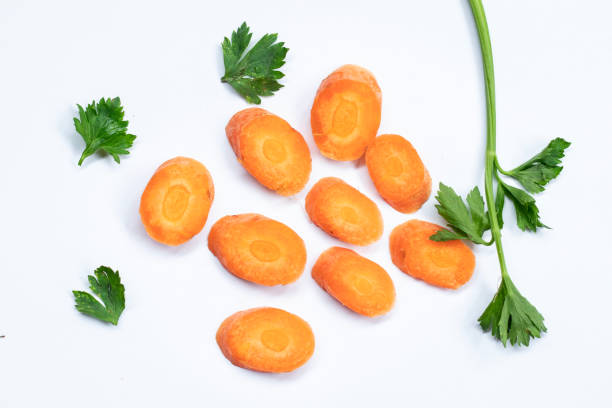 istock Carrot slices. Isolate carrot slices. Carrots, parsley on white background. Vegetables with spices. 1929686417