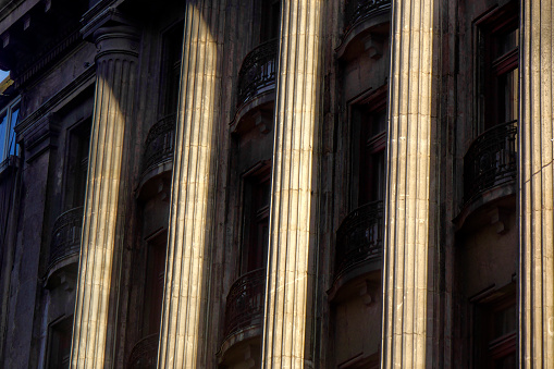 Entrance to an ancient Roman temple building with stone columns. 3D illustration.