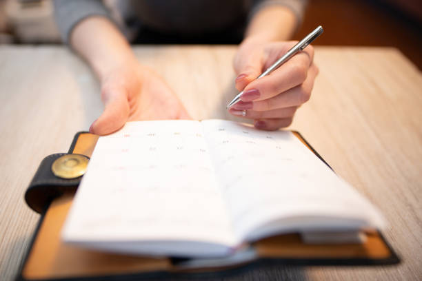 istock Hand of a woman writing in a notebook 1929715652